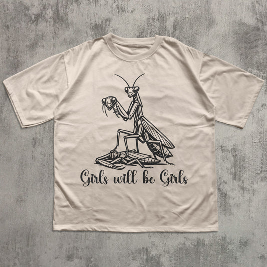 Beige t-shirt with a praying mantis graphic and text on a textured gray background