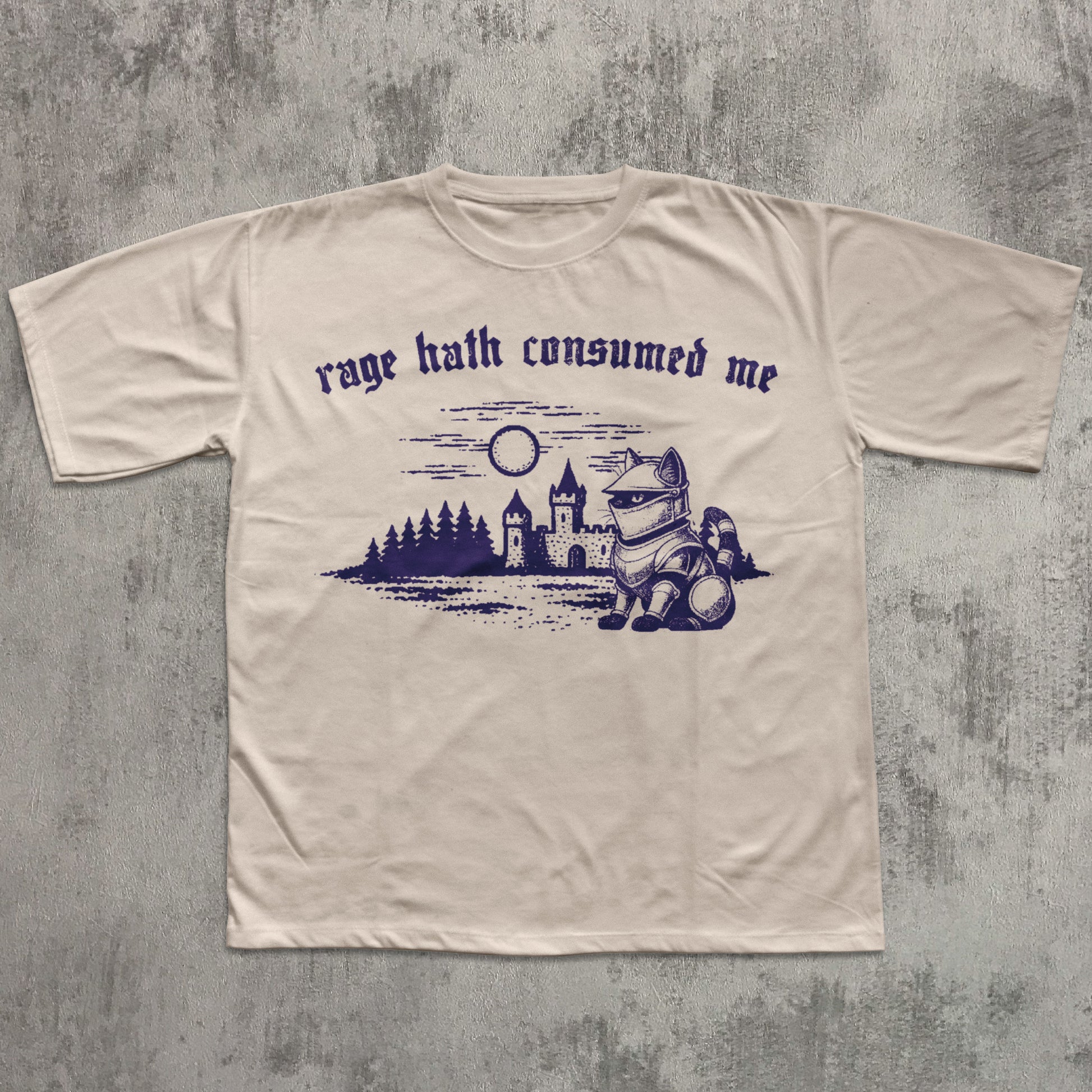 Beige t-shirt with purple graphic and text on a textured gray background