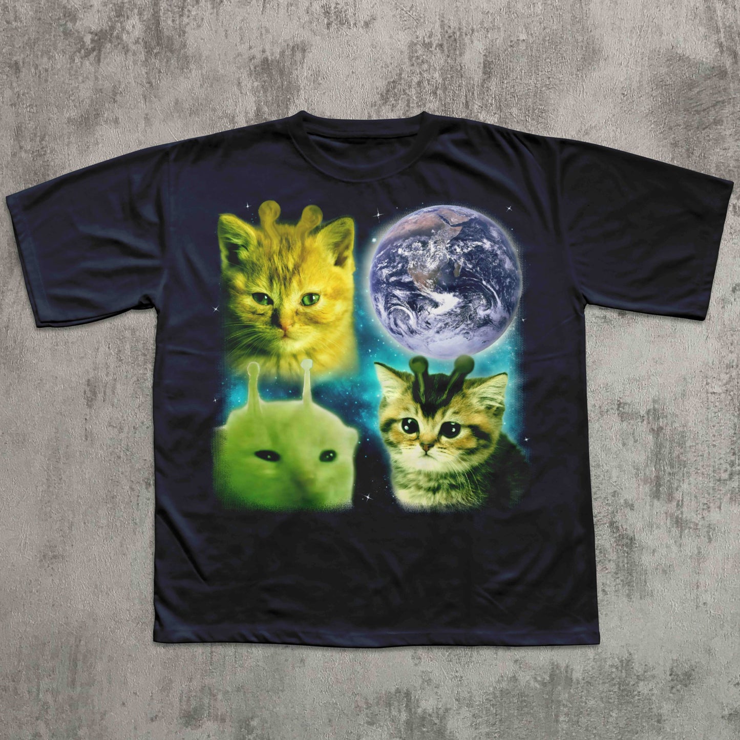 Black t-shirt with alien cats and Earth graphic on a textured gray background