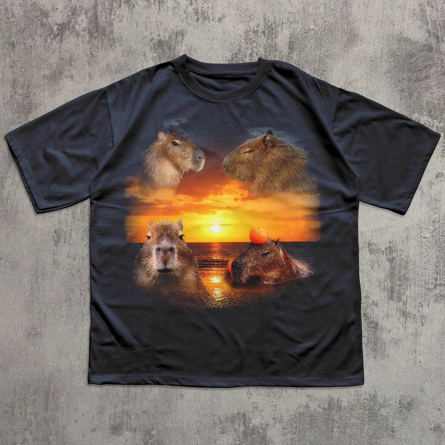 Black t-shirt with capybara design on a sunset background