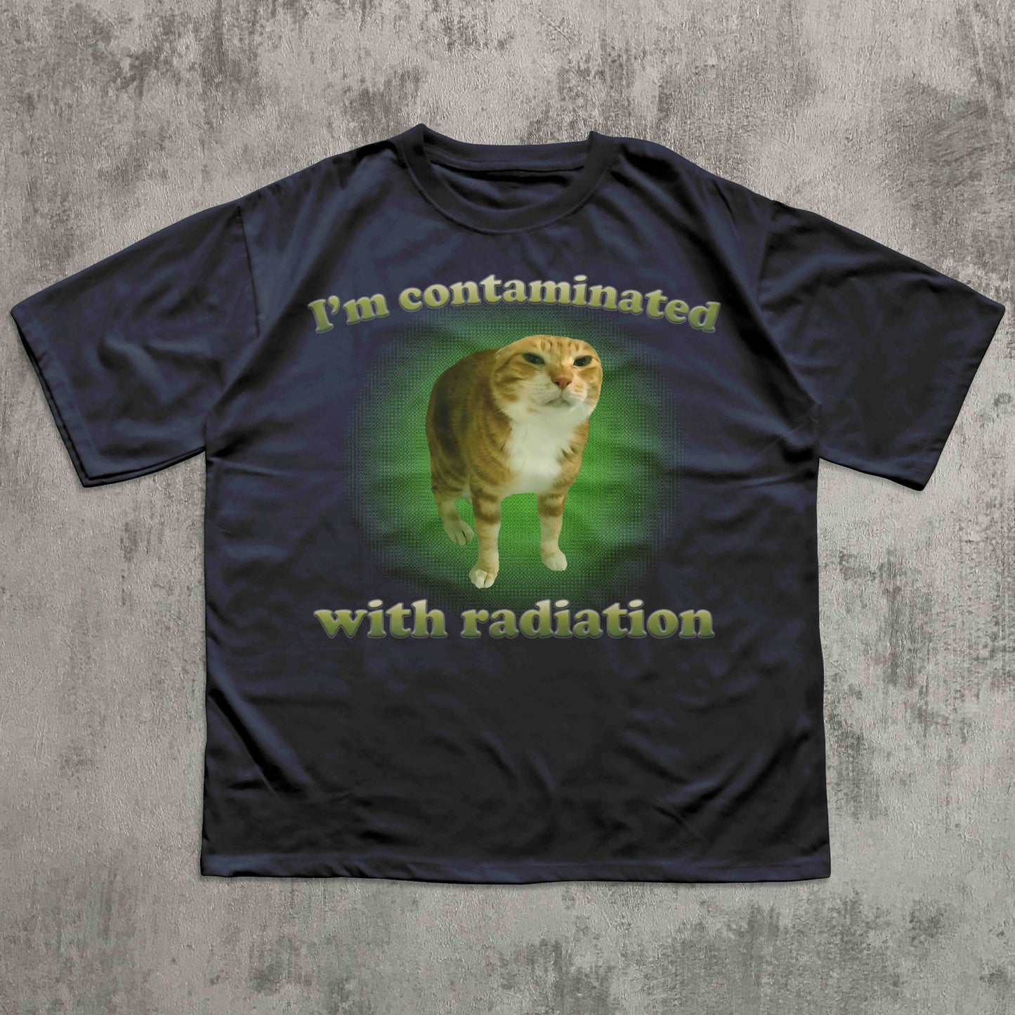 Black t-shirt with a cat graphic and text on a textured gray background