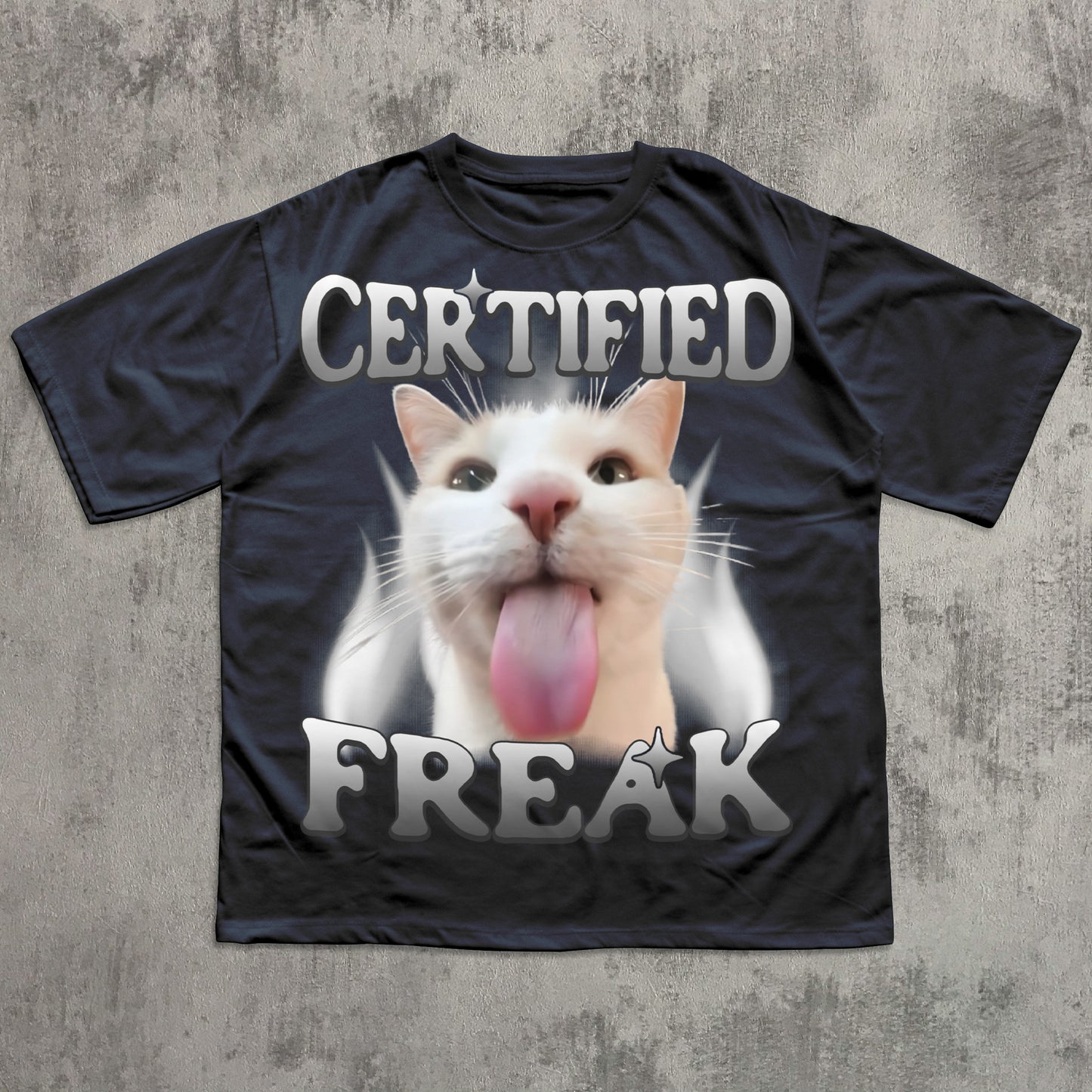 Black t-shirt with a cat graphic and 'Certified Freak' text on a textured gray background