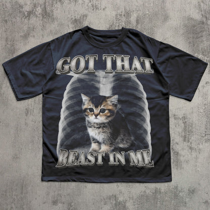 Black t-shirt with a graphic of a cat and text 'GOT THAT BEAST IN ME' on a textured gray background