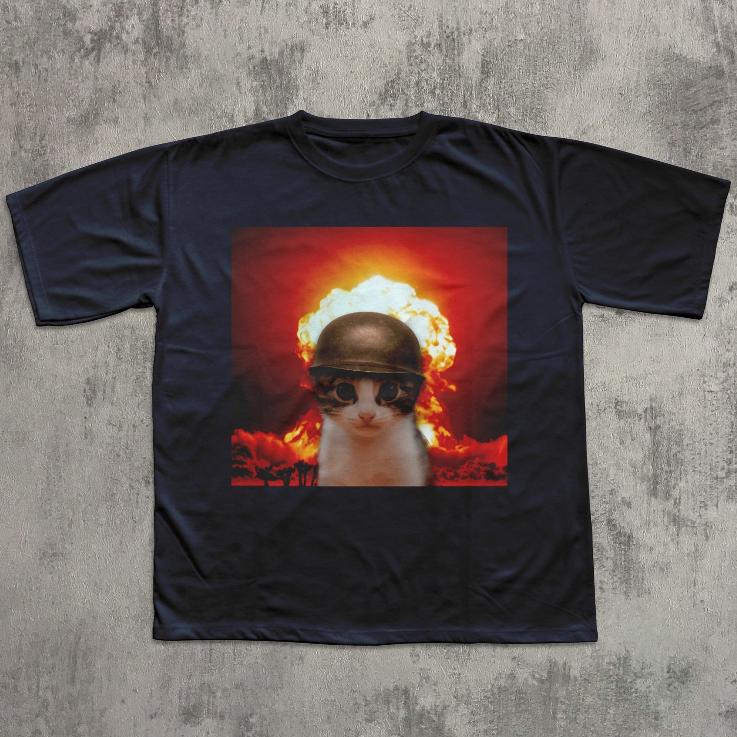 Black t-shirt with a graphic of a cat wearing a helmet and sunglasses in front of an explosion on a concrete surface.