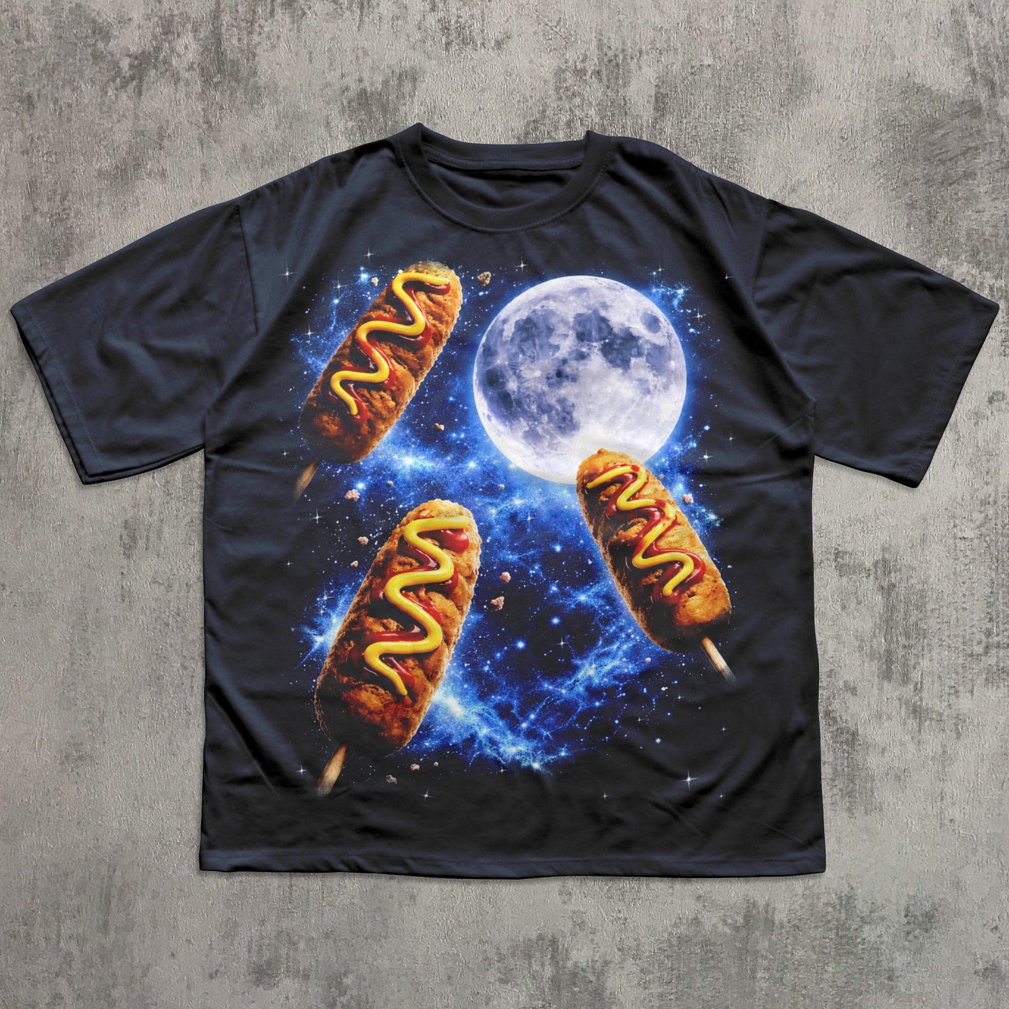 Black t-shirt with hot dog graphic and moon on a textured gray background