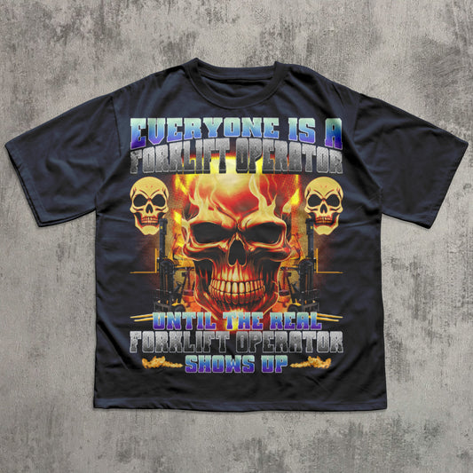 Black t-shirt with a graphic design featuring skulls and text on a concrete background