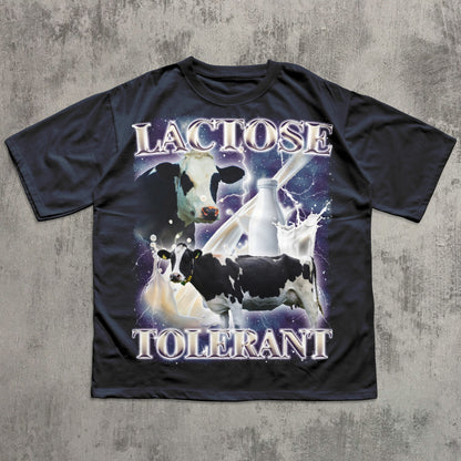 Funny Navy t-shirt with cow graphic and 'LACTOSE TOLERANT' text on a textured gray background