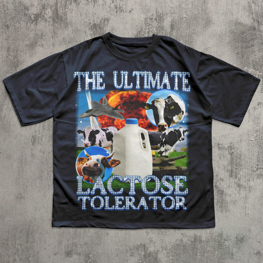 Black t-shirt with dairy-themed graphic and text on a concrete surface