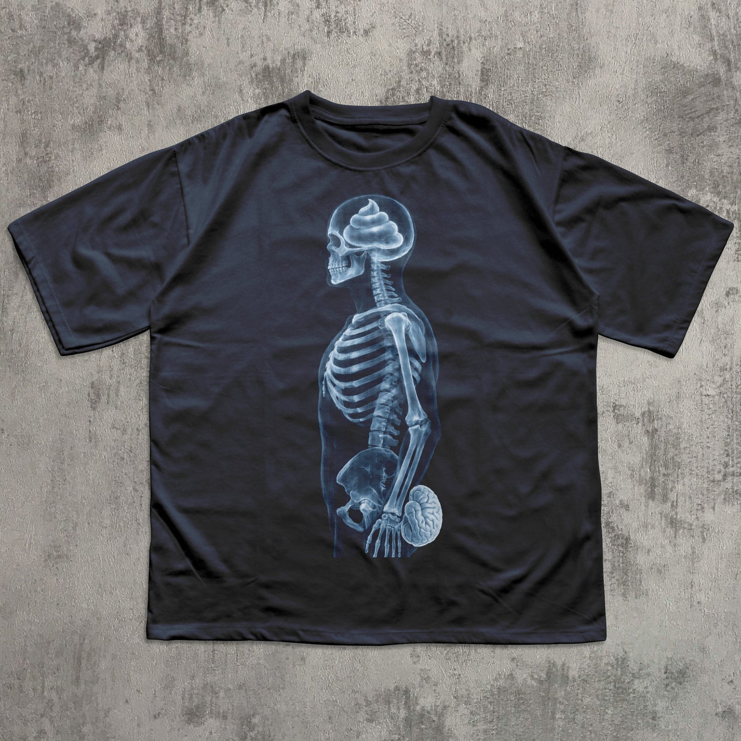 Humorous navy graphic T-shirt featuring a blue X-ray skeleton with a poop-shaped brain in the skull and the brain held at the crotch, funny anatomy joke shirt