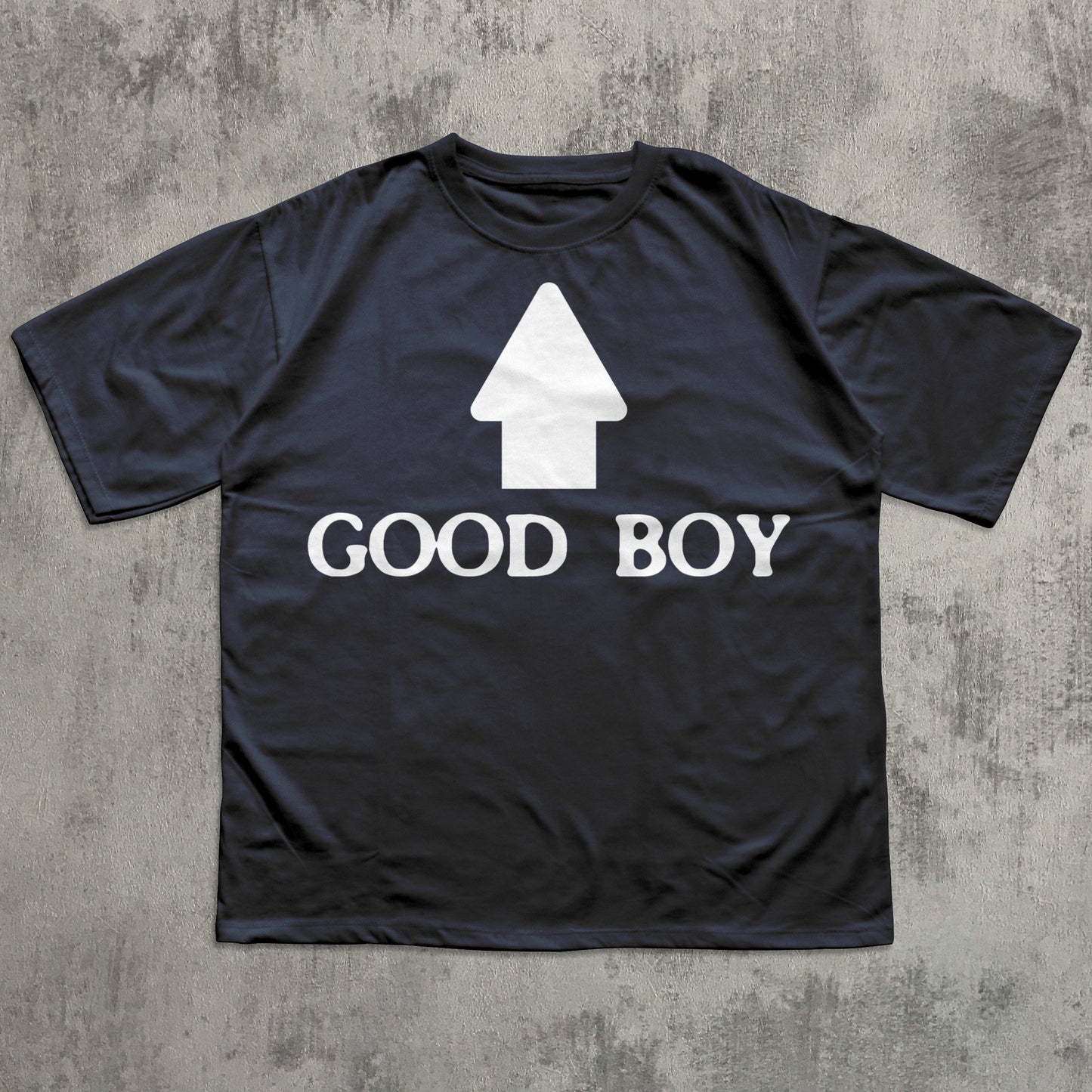 Black t-shirt with 'GOOD BOY' and doghouse graphic on a textured gray background