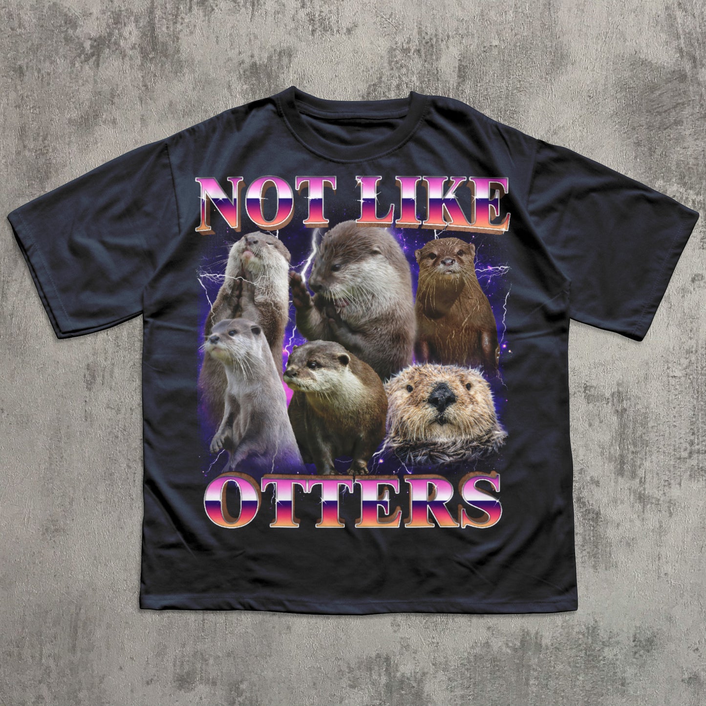 Black t-shirt with otter graphic and text 'Not Like Otters' on a textured gray background