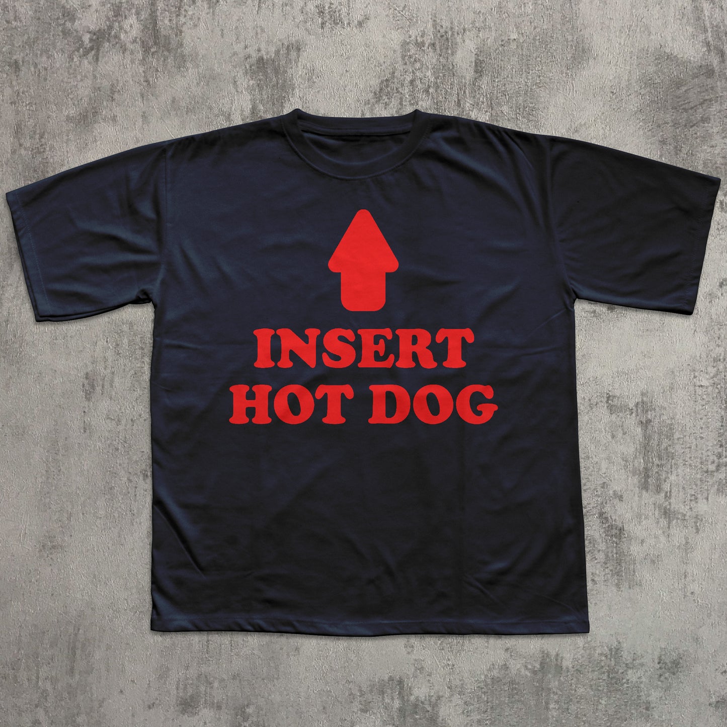 Black t-shirt with red graphic and text 'INSERT HOT DOG' on a textured gray background