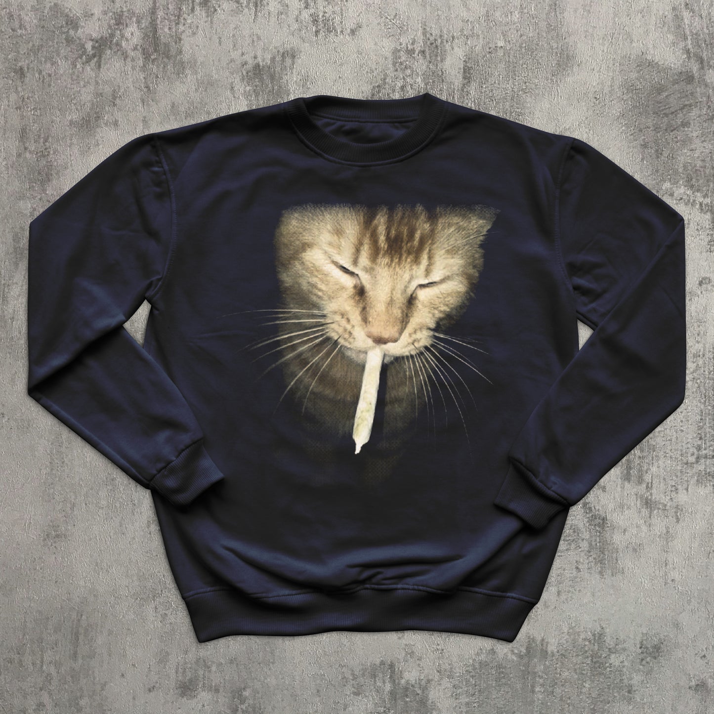 Navy blue sweatshirt with a cat graphic on a textured gray background