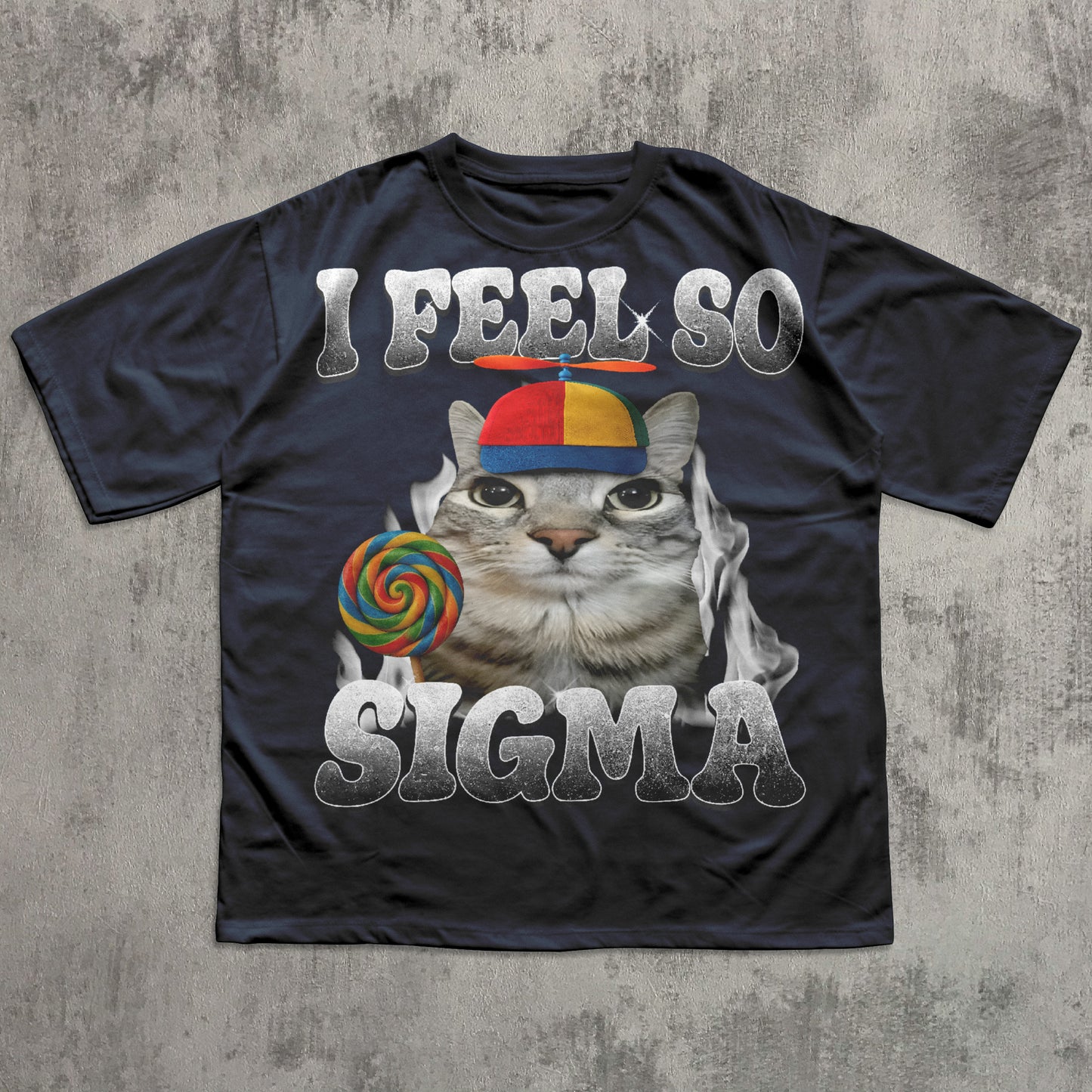Black t-shirt with a cat meme graphic and text 'I Feel So Sigma' on a textured gray background