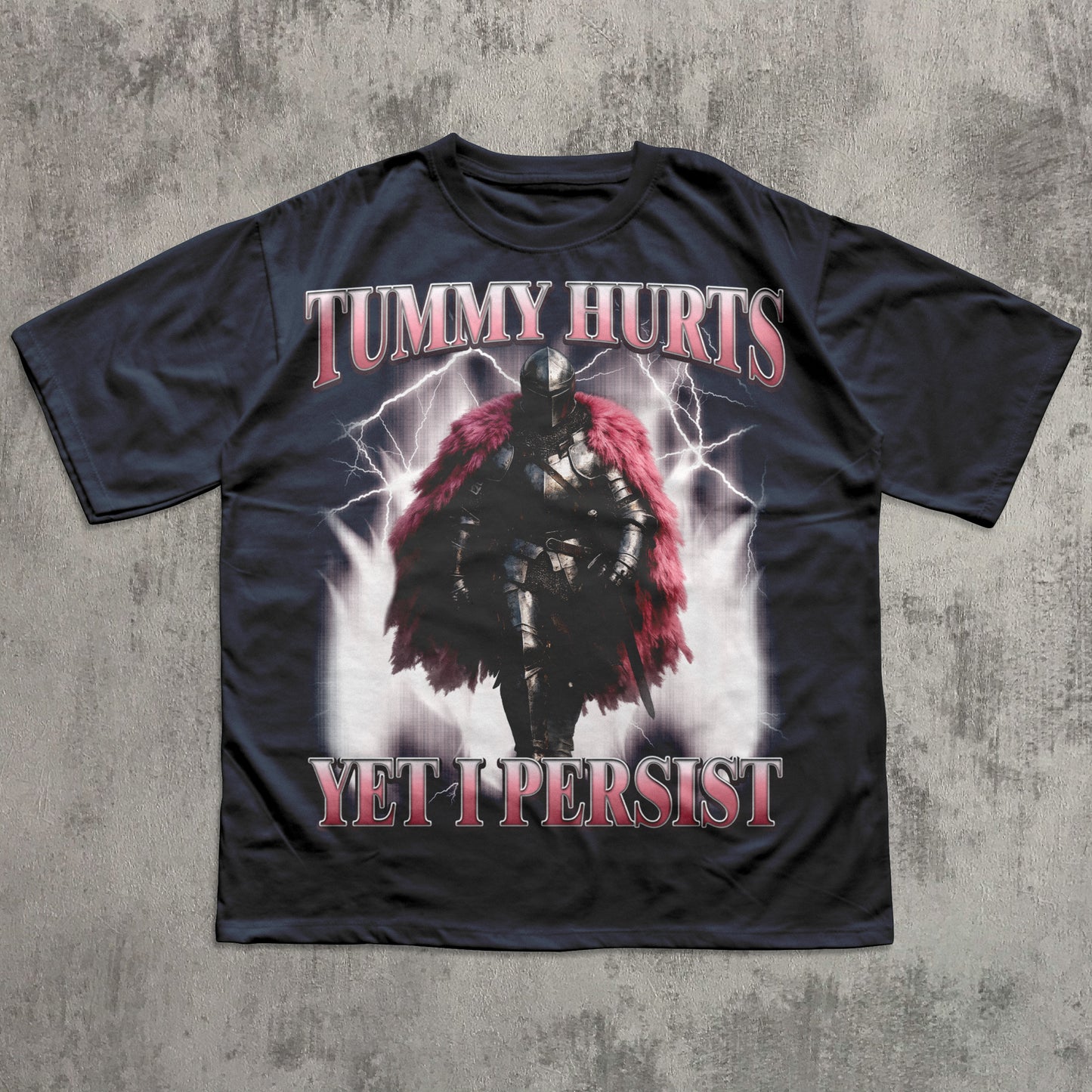 Navy t-shirt with warrior graphic and text 'Tummy Hurts Yet I Persist' on a textured gray background