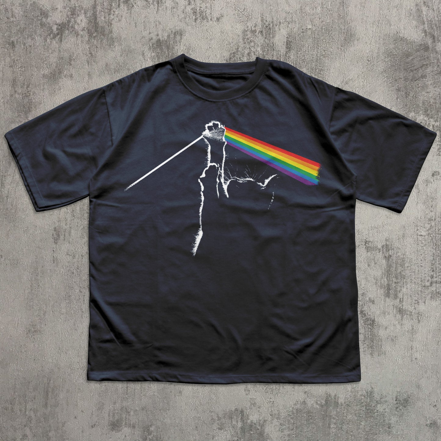 Black t-shirt with a graphic design on a textured gray surface
