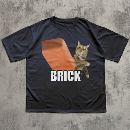 Black t-shirt with a cat graphic and 'BRICK' text on a textured gray background