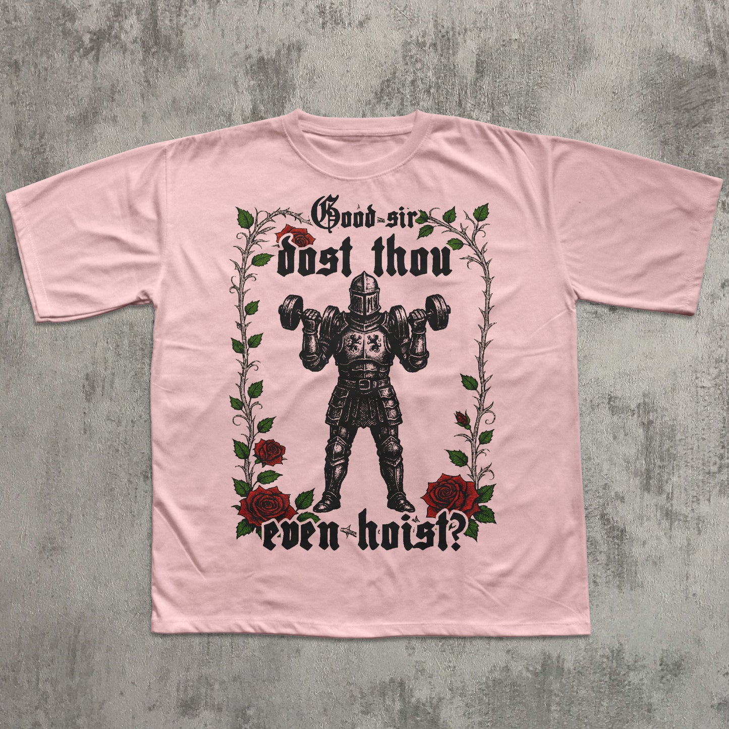 Pink t-shirt with graphic design and text on a textured gray background