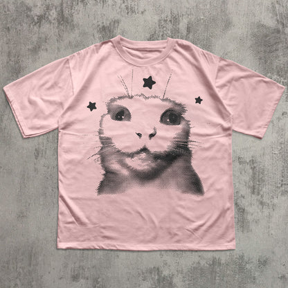 Pink t-shirt with a black cat graphic on a textured gray background