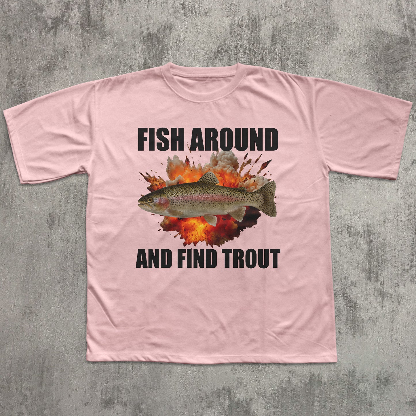 Pink t-shirt with fish graphic and text on a textured gray background