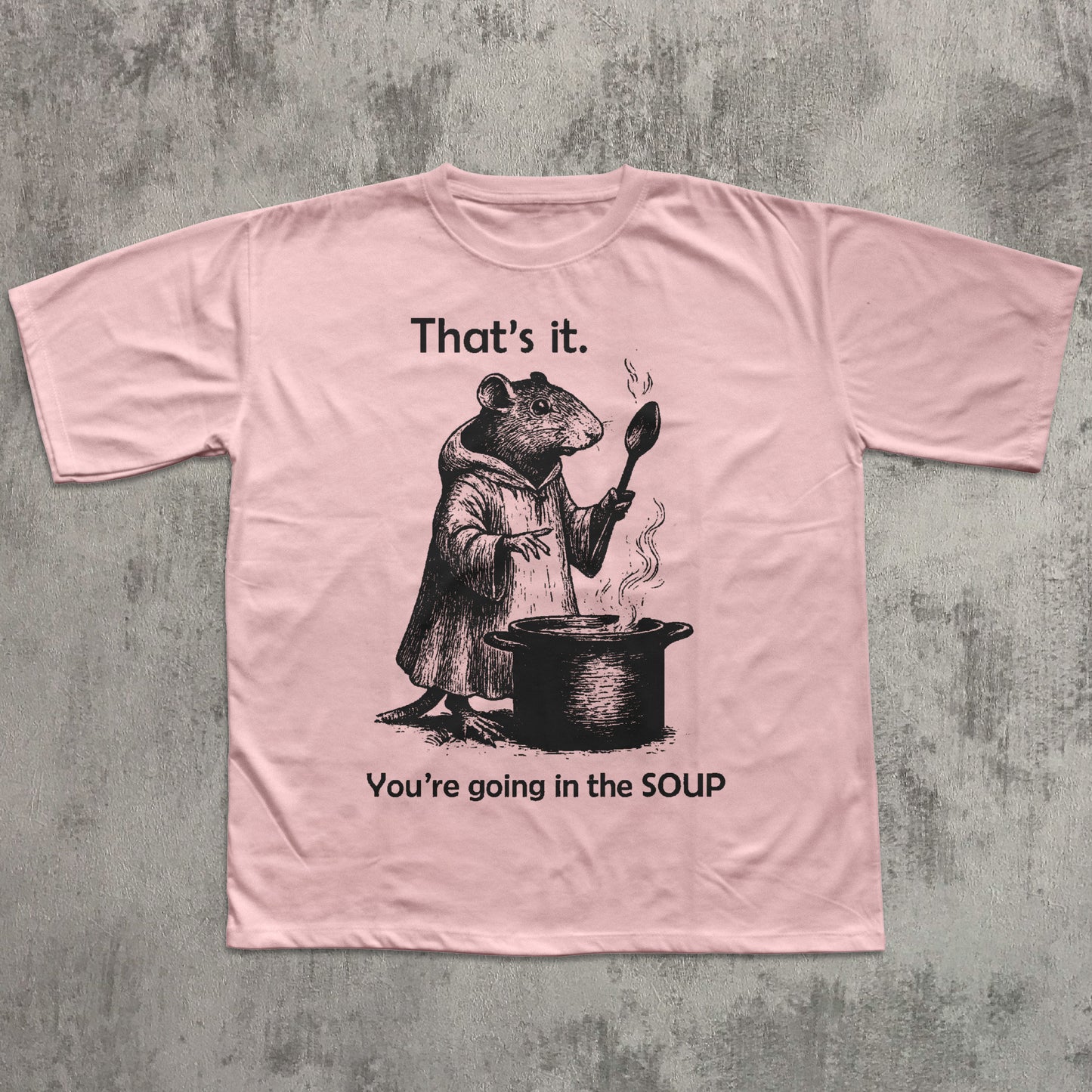 Pink t-shirt with a graphic of a rat and text on a textured gray background