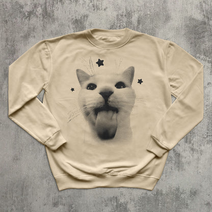 Beige sweatshirt with a graphic of a dog face on a textured gray background