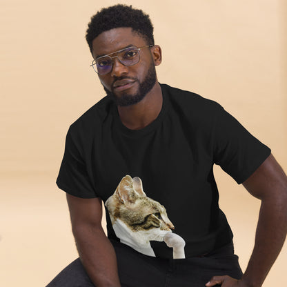 Man wearing a black t-shirt with a cat graphic on a beige background