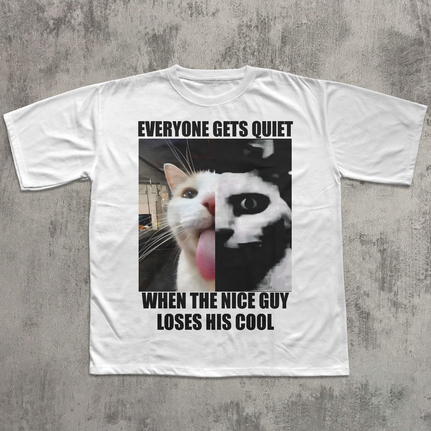 White t-shirt with a graphic of a cat and text on a concrete surface