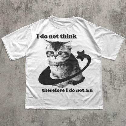 White t-shirt with a cat graphic and text on a concrete surface