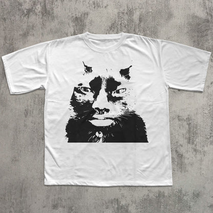White t-shirt with a black cat graphic on a gray textured background