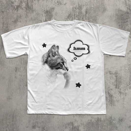 White t-shirt with a graphic of a Cat and 'hmm' text on a textured gray background