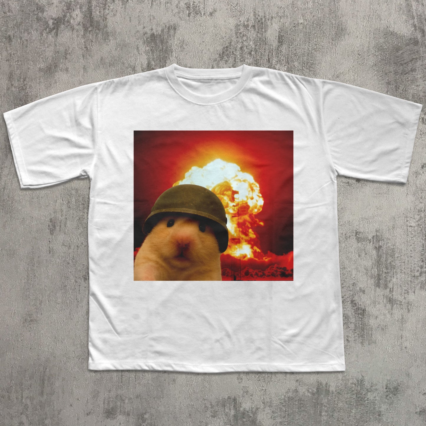 White t-shirt with a graphic of a hamster wearing a helmet in front of an explosion on a textured gray background