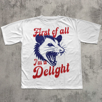 White t-shirt with a graphic of an opossum and text on a gray concrete background