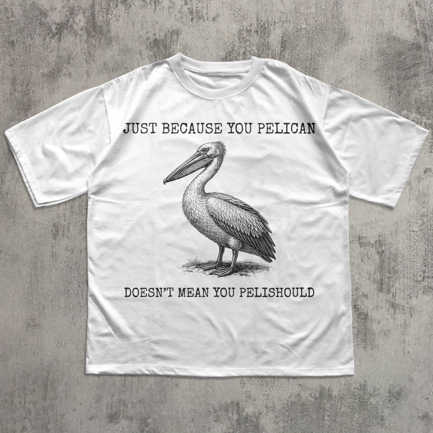 White t-shirt with a pelican graphic and humorous text on a textured gray background