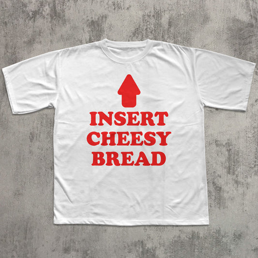 White t-shirt with red text and arrow graphic on a gray concrete background