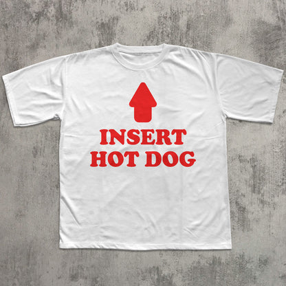 White t-shirt with red graphic and text 'Insert Hot Dog' on a gray concrete background