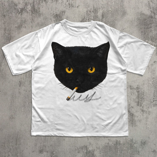 White t-shirt with a black cat graphic holding a cigarette on a concrete surface